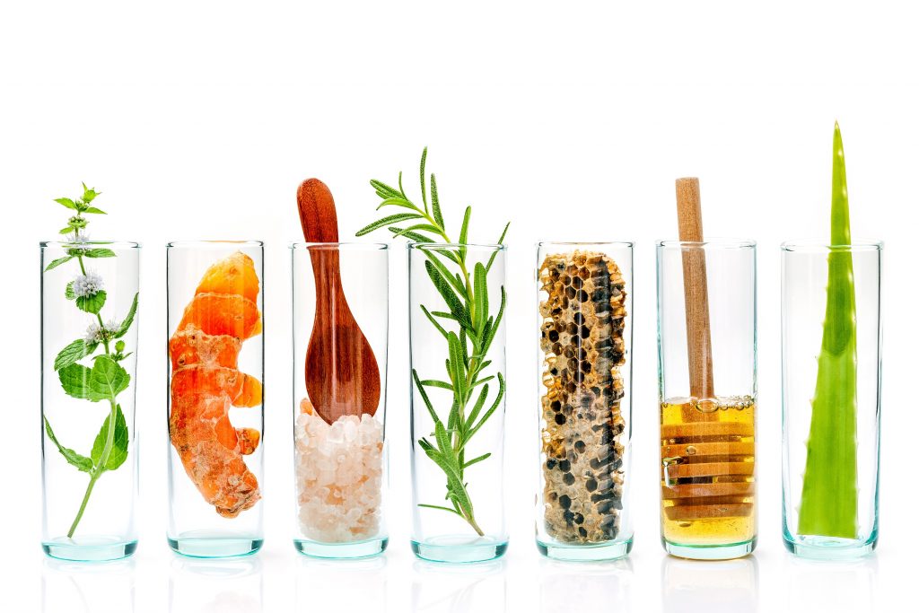 Plants and foods in glass bottles.