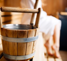 Wooden bucket in Finnish sauna.