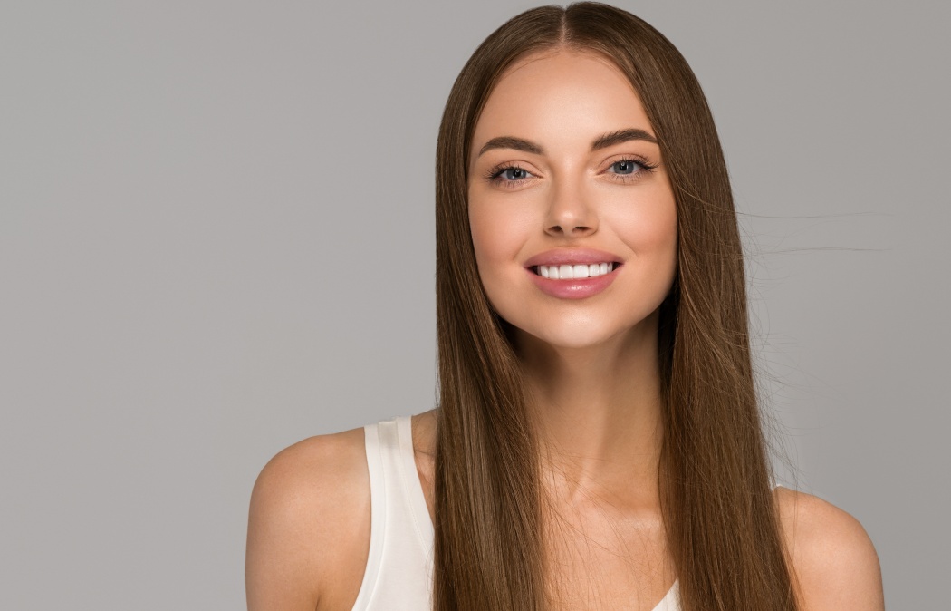 Beautiful woman teeth smile with healthy long hair beauty skin clean and fresh female young model portrait